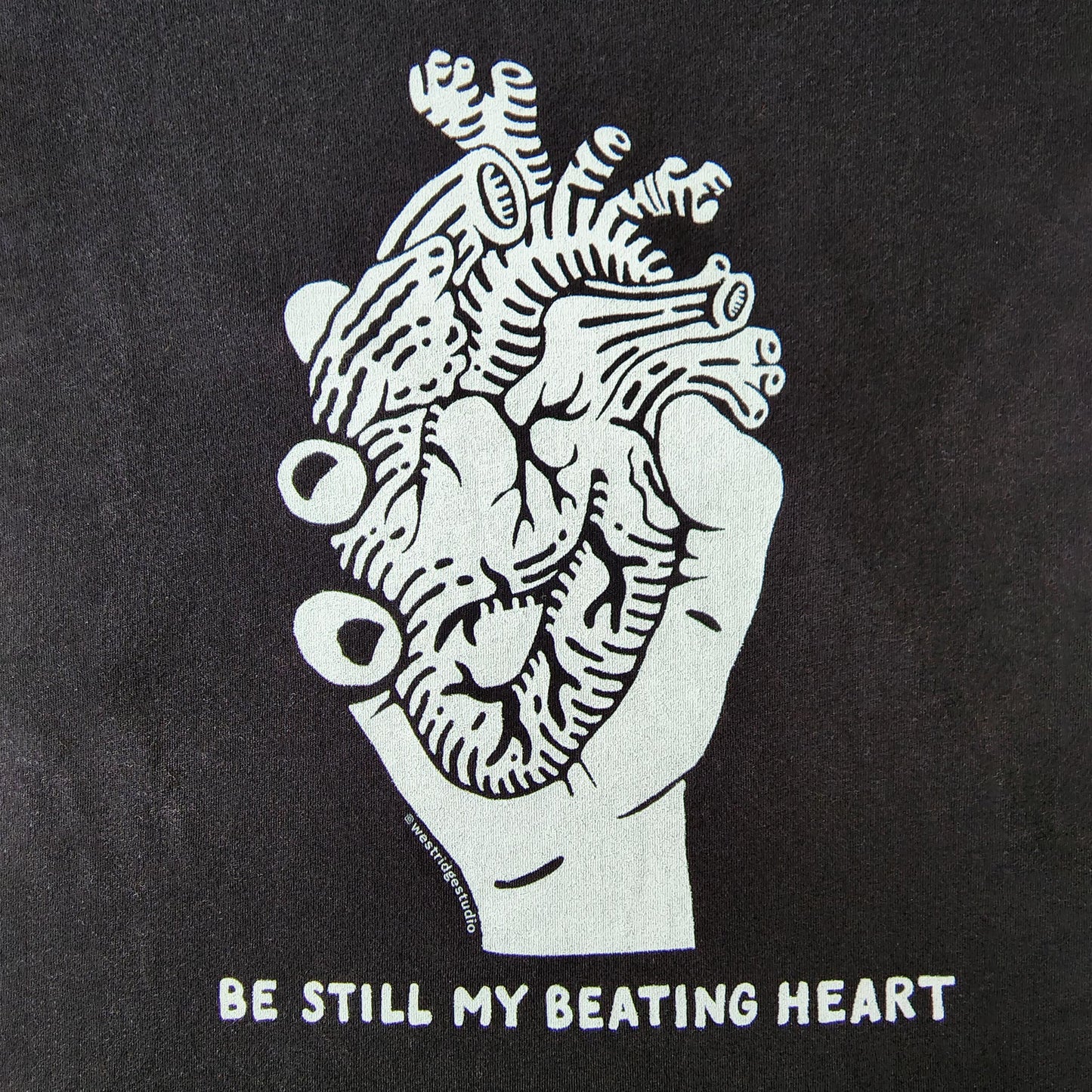 Be Still My Beating Heart eco graphic black t-shirt for unisex and men's cuts - detail of heart graphic